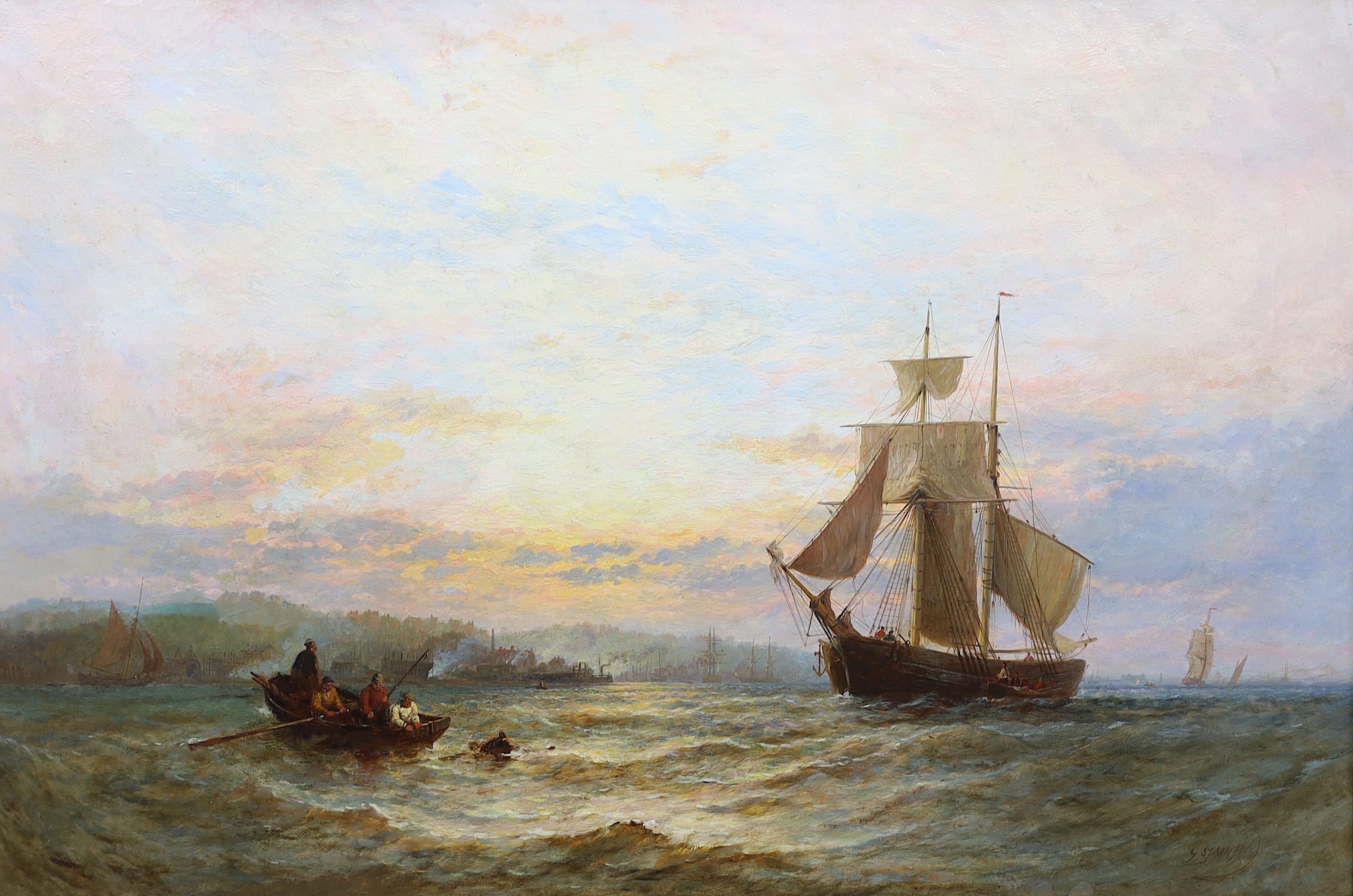 George Stainton (British, fl. 1860-1890), Shipping in a calm sea at dawn, oil on canvas, 60 x 90cm